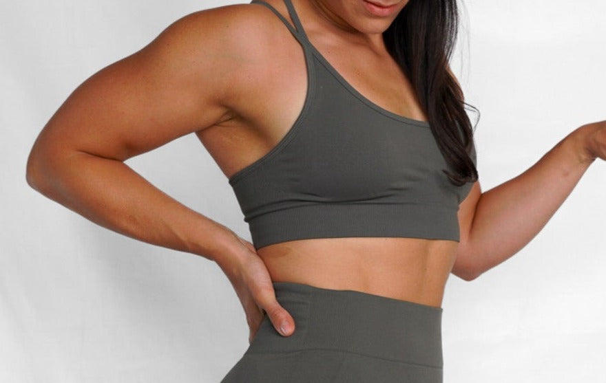 strappy back seamless sports bra with removable cup pads, ultra soft and comfortable back view in steel grey front oblique view