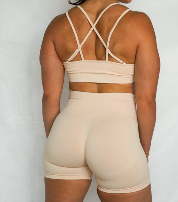 strappy back seamless sports bra with removable cup pads, ultra soft and comfortable back view in cosmic latte