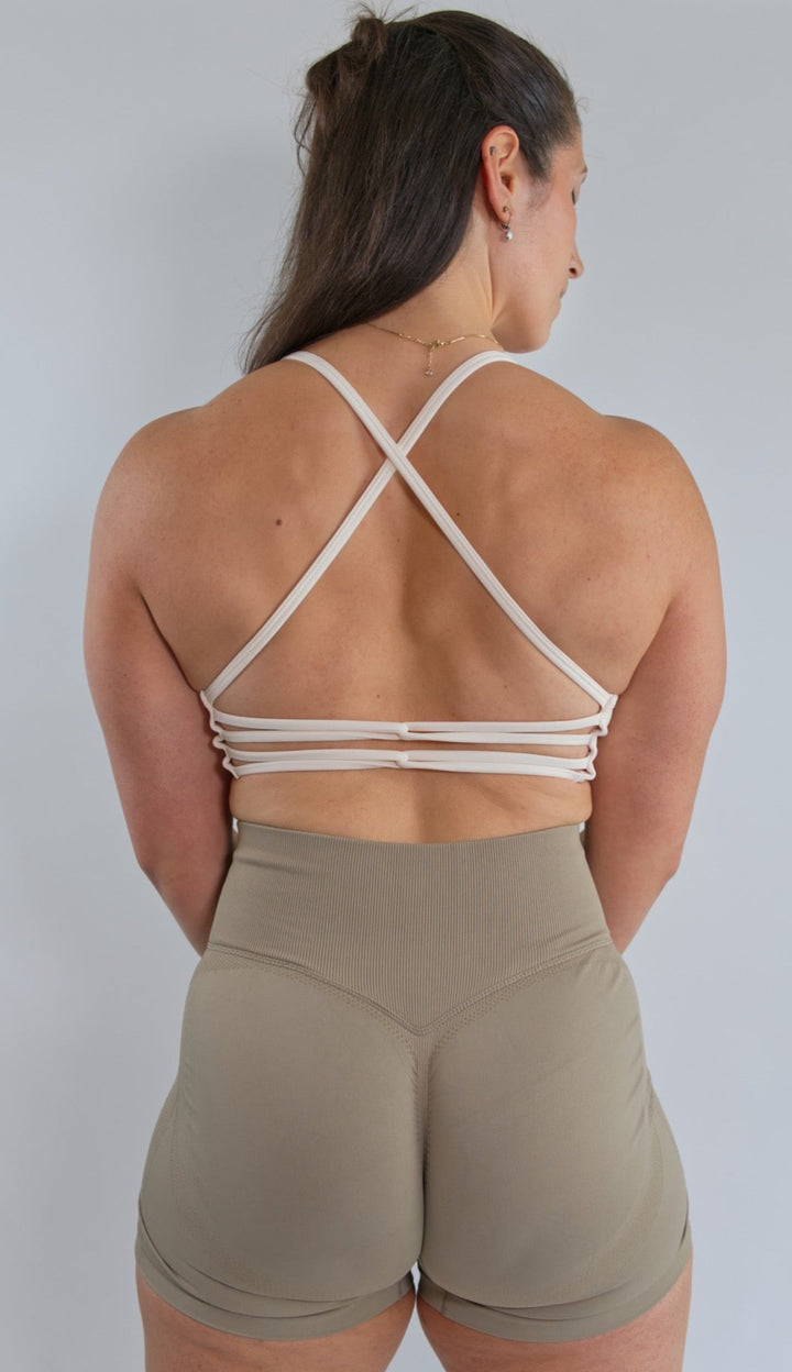 strappy back sports bra off white sweet cream back view